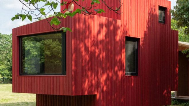 Photography: compact forest cabin by wiki world takes shape as a red wooden subm