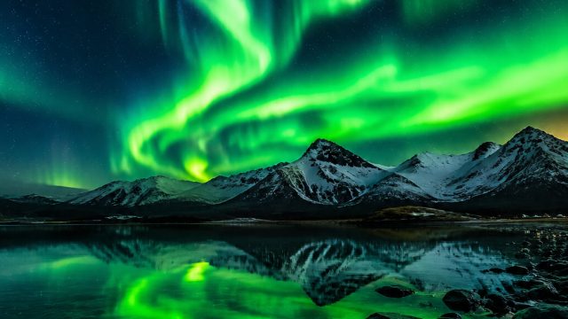Mesmerizing Neon Green Aurora: A Cosmic Wallpaper Experience
